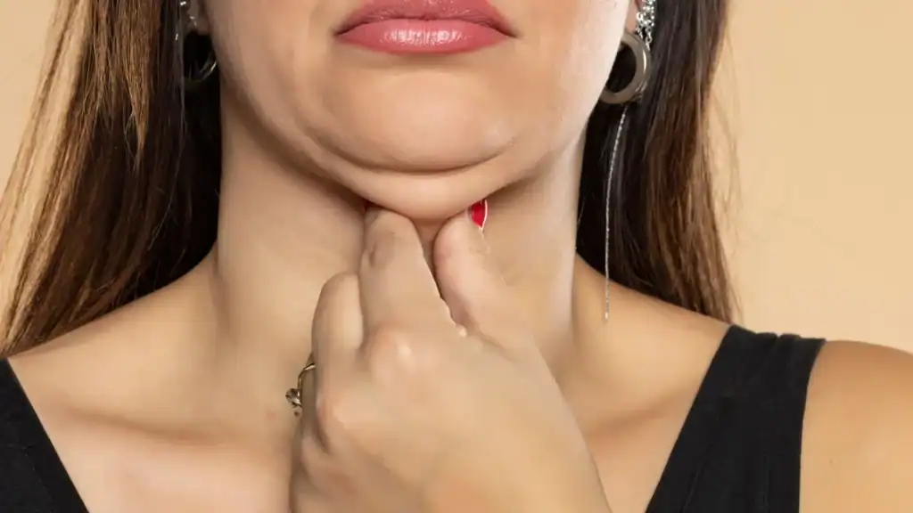 An image of a woman with double chin, sad, worried : Non Surgical Double Chin Removal Treatment in Esher, UK